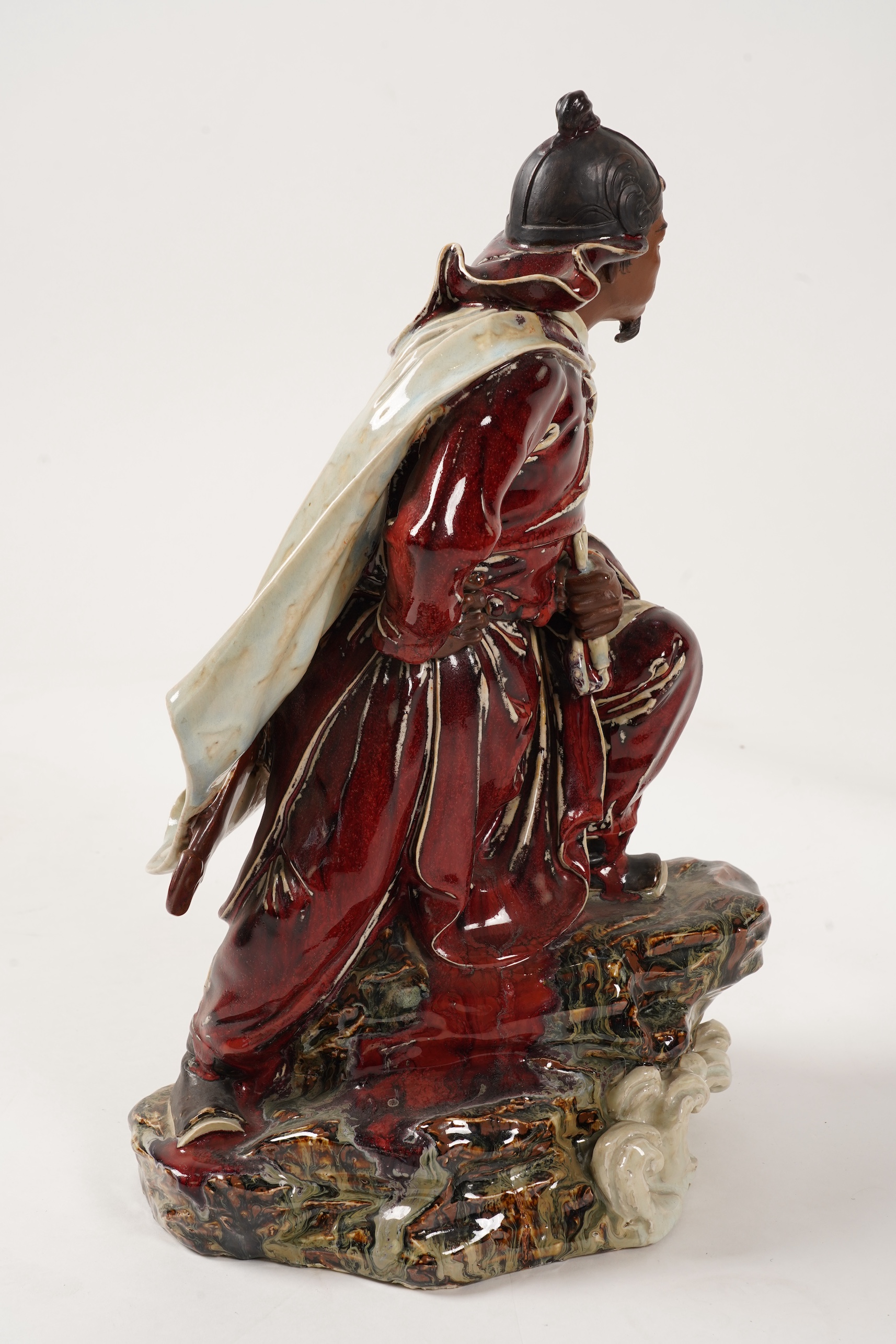 A large Chinese Shiwan stoneware figure of a warrior, 20th century